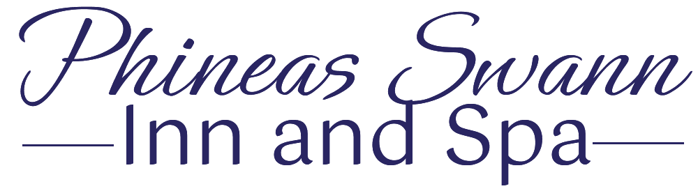 Text logo for Phineas Swann Inn and Spa in elegant dark purple font.